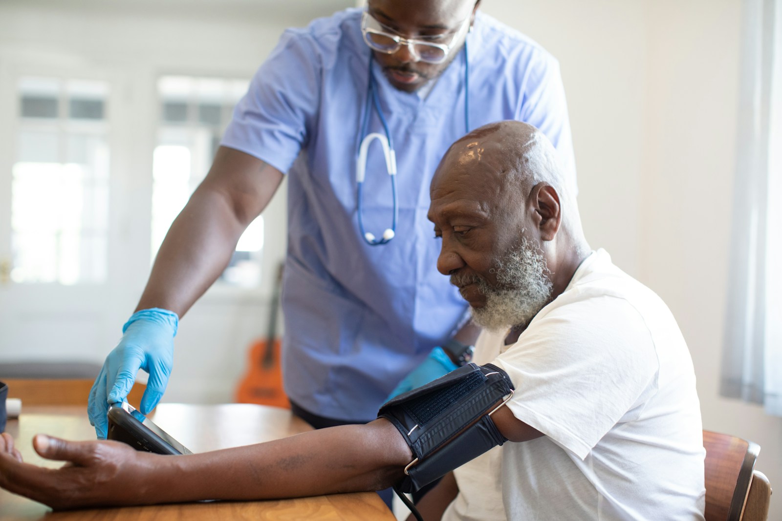 a doctor checking a patient's blood pressure, medicare